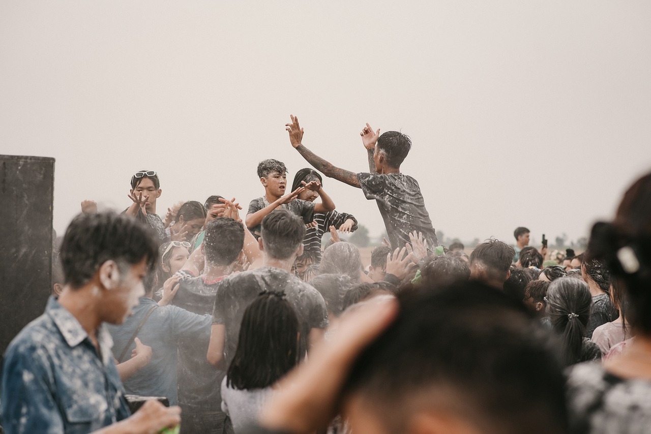 Young people celebrating together at an outdoor water festival